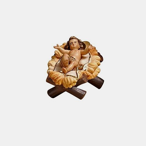 Detailansicht der holzgeschnitzten Kostner Krippenfigur Jesuskind mit Wiege aus Bergahorn handbemalt