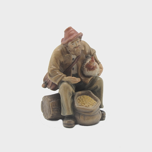 Krippenfigur Zirbel 037 Hirt sitzend mit Futtersack und Henne
